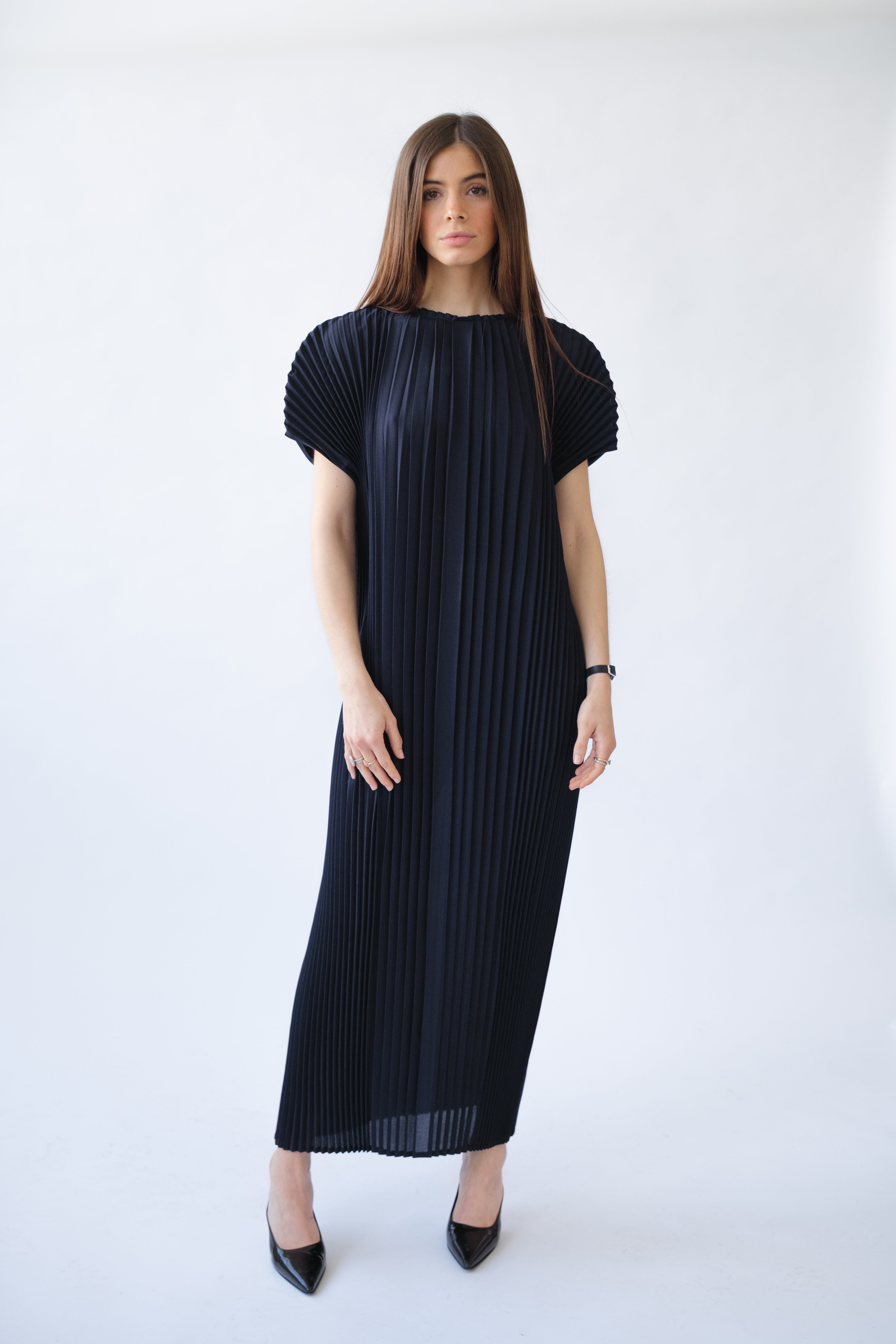 a female model wearing navy blue maxi wrinkle-resistant hand-pleated dress