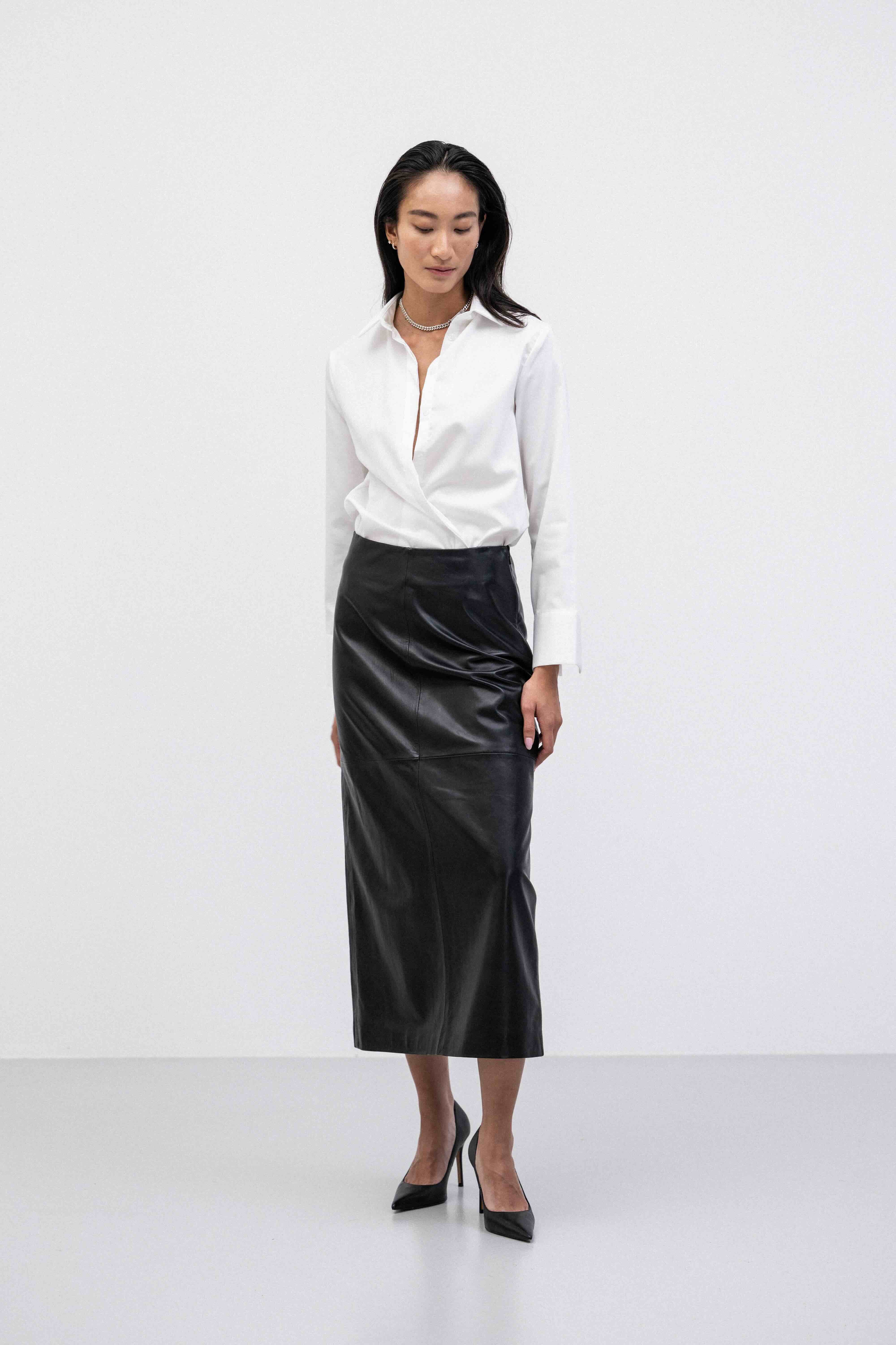 Woman wearing a white shirt and breathable buttery-soft lamb leather straight pencil maxi skirt 
