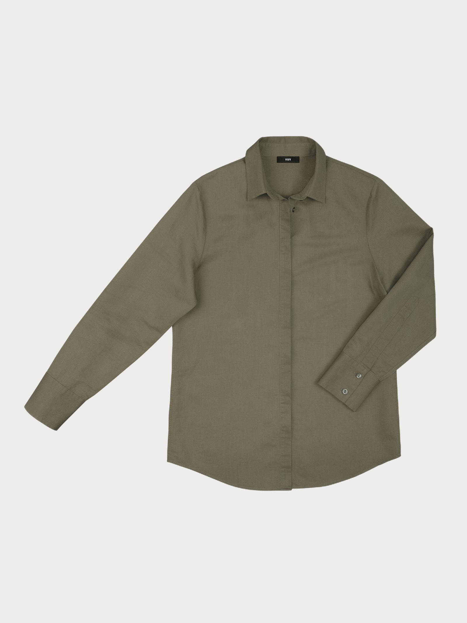Olive green long-sleeve button-up yvy shirt with a classic collar, laid flat against a light background. The shirt features a minimalist design with buttoned cuffs and a clean, tailored look.
