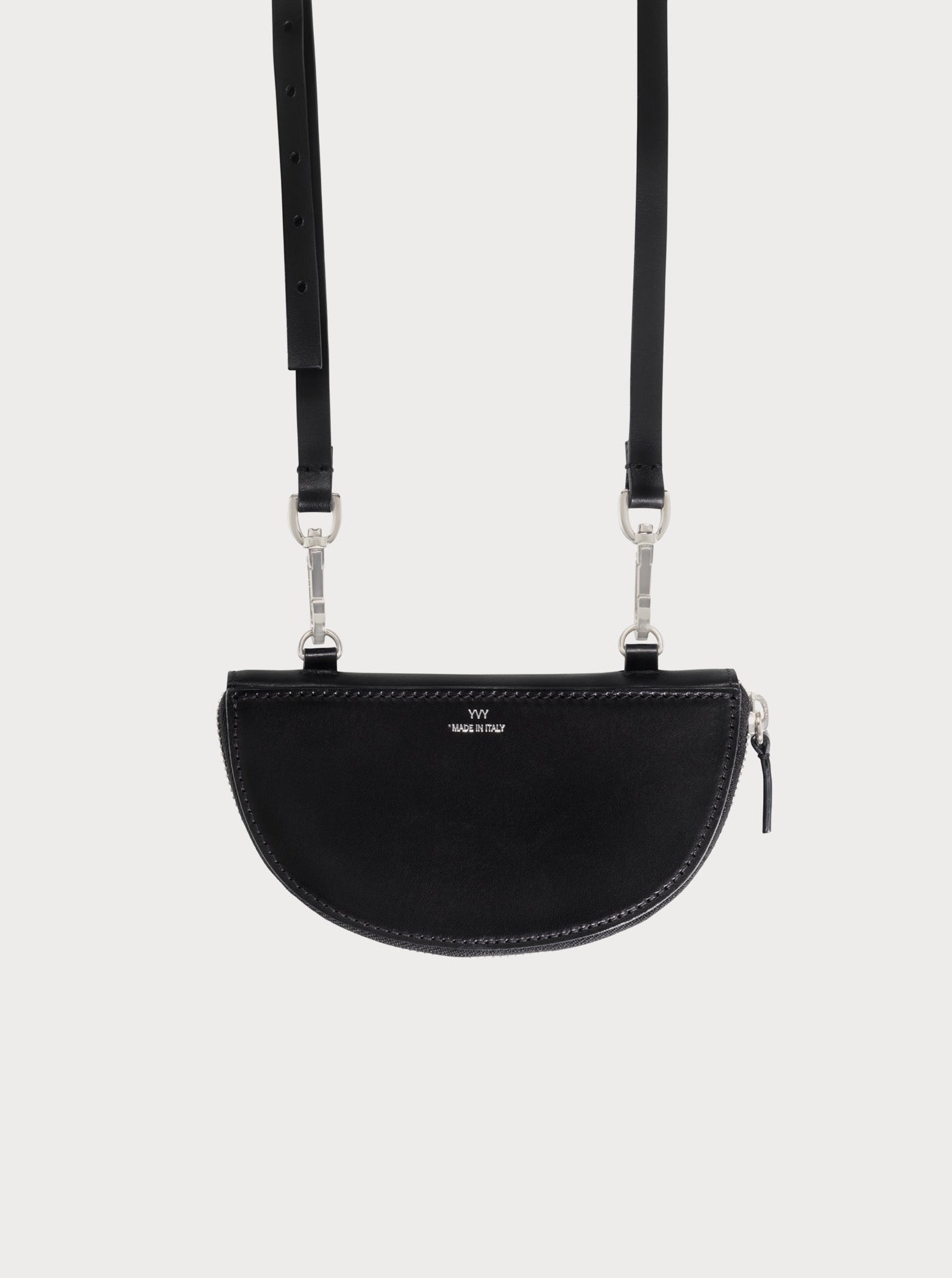 yvy leather half moon pouch attached to shoulder straps