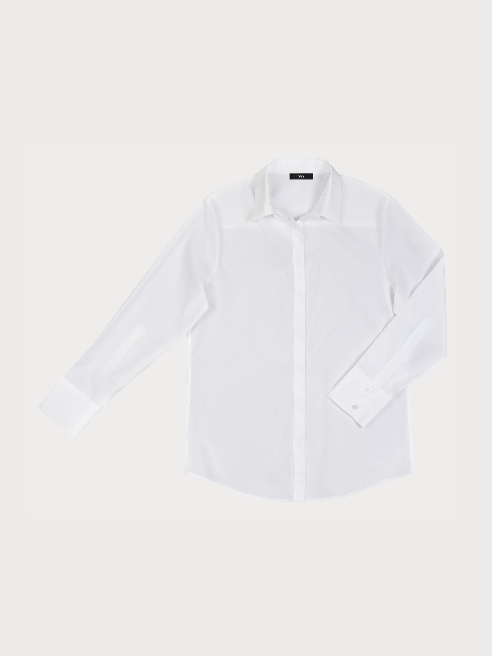 White long-sleeve yvy cotton shirt, displayed flat against a plain background