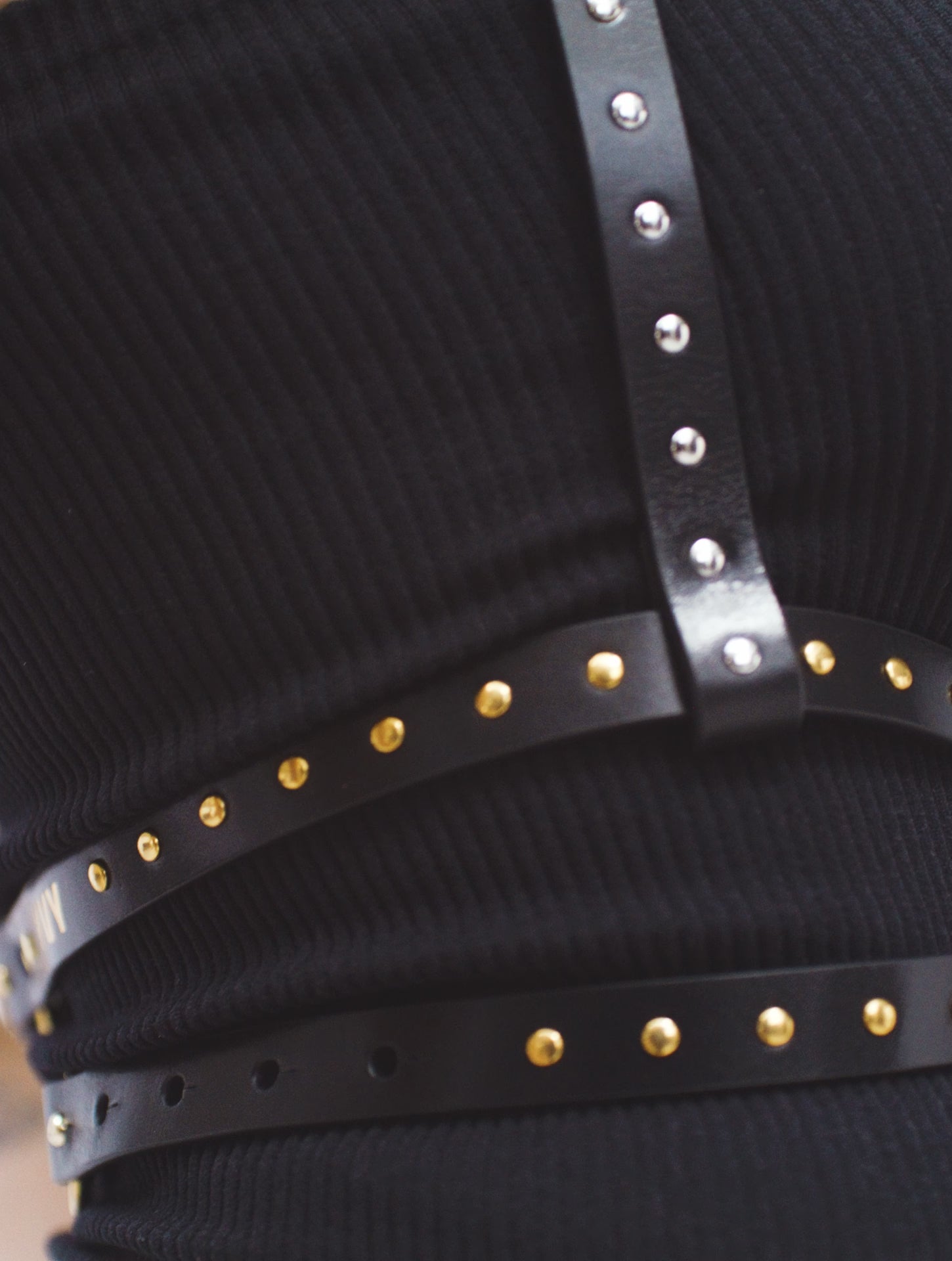 a video of a female model wearing the studded wrap belt in movement