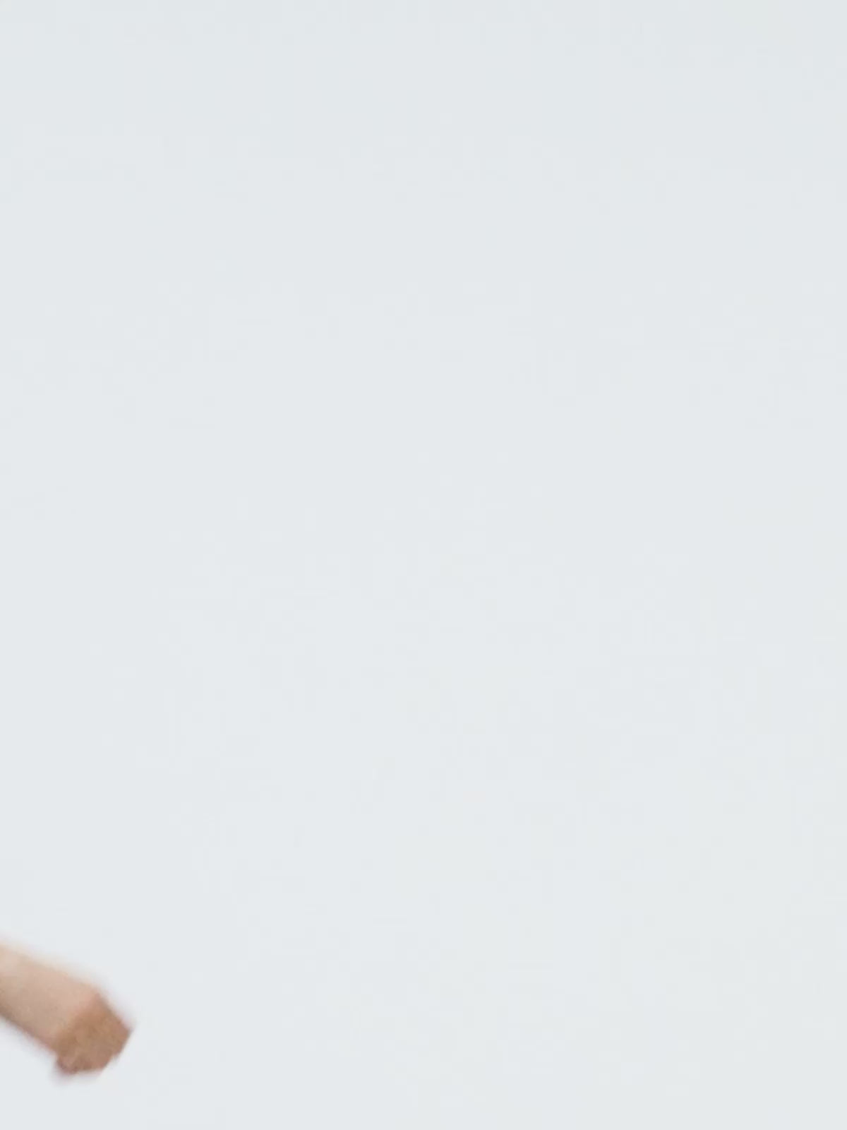 a female model posing in black leather yvy choker, white yvy cotton shirt and a round black leather yvy shoulder bag