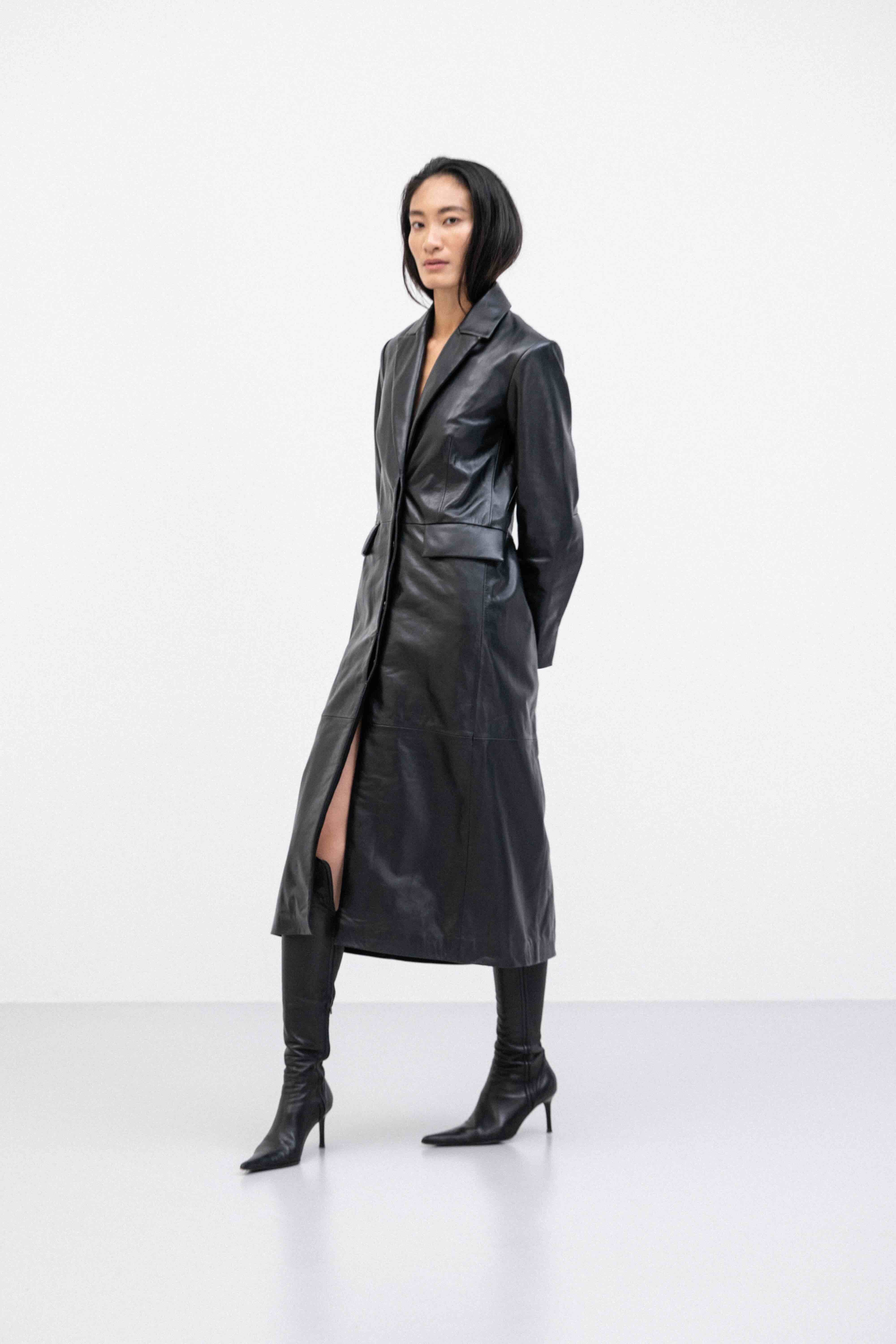 Person wearing a breathable durable lambskin leather coat for transitional spring weather