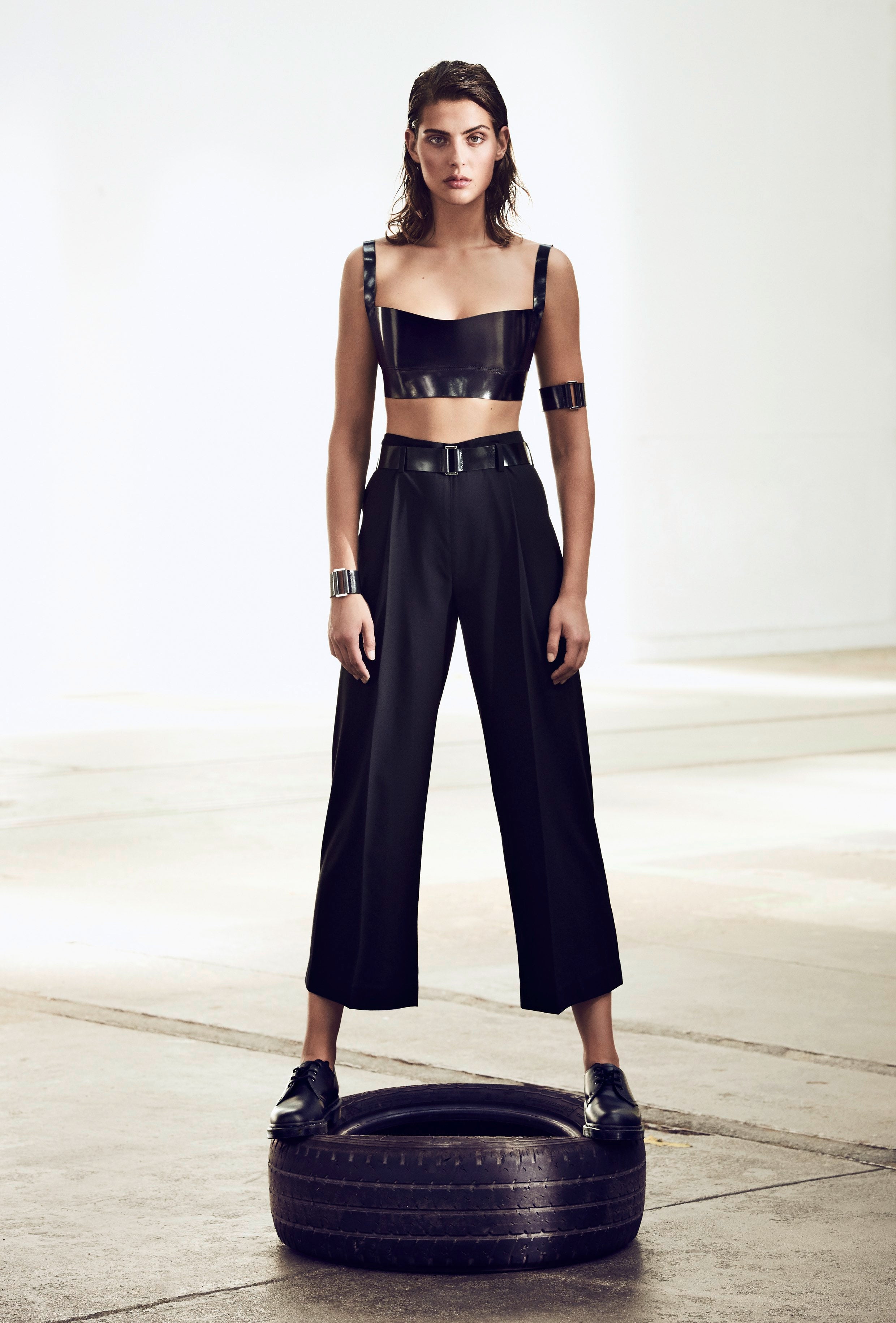 a female model wearing yvy accessories with black yvy trousers 7/8 length