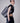 woman carrying yvy leather spirit tote bag with black cropped top and pants
